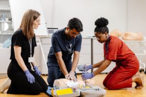 Medical Professionals Practicing CPR on a Training Dummy